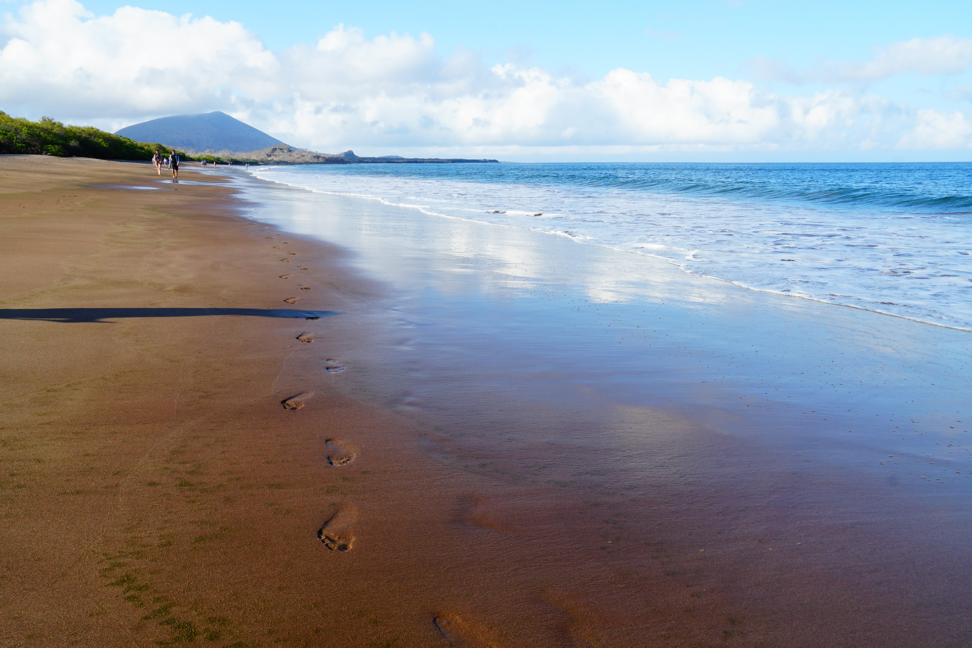 The view down Espumilla Beach on Santiago Island. Cate and Jake are seen in the distance, walking back to where the Zodiac will pick us up.